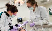 Dental assistant working on a patient